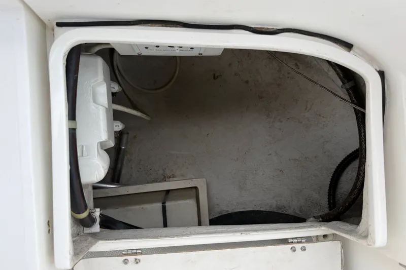 Slide: The Image of Storage compartment of a 2007 Catalina 34 MkII sailboat, showing interior details and wiring. - 41