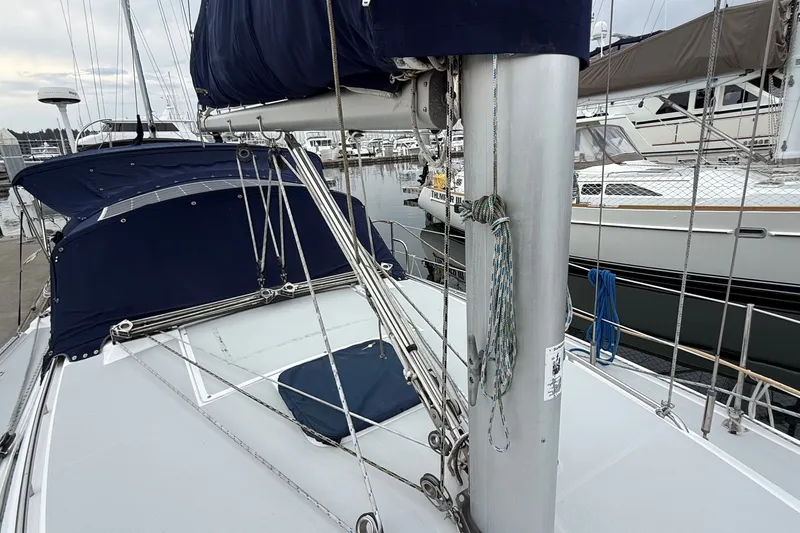 Slide: The Image of 2007 Catalina 34 MkII sailboat deck with blue covers and rigging in marina. - 21