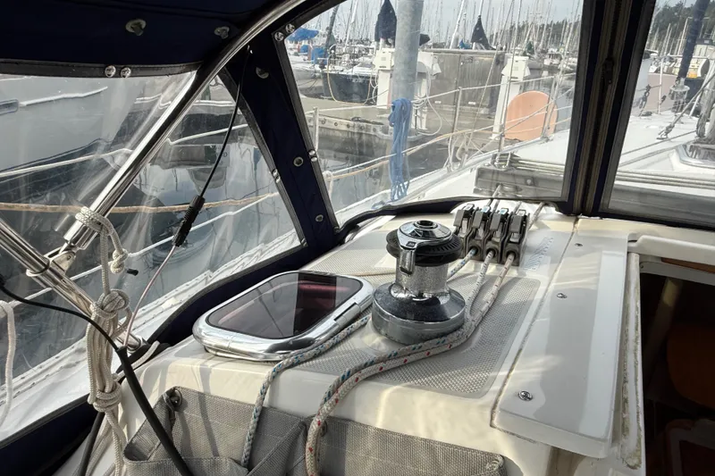 Slide: The Image of Interior view of a 2007 Catalina 34 MkII sailboat cockpit with winch and ropes. - 37