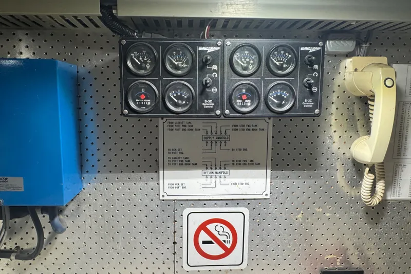 Slide: The Image of Control panel with gauges and phone on a 1989 DeFever 54 yacht. - 49