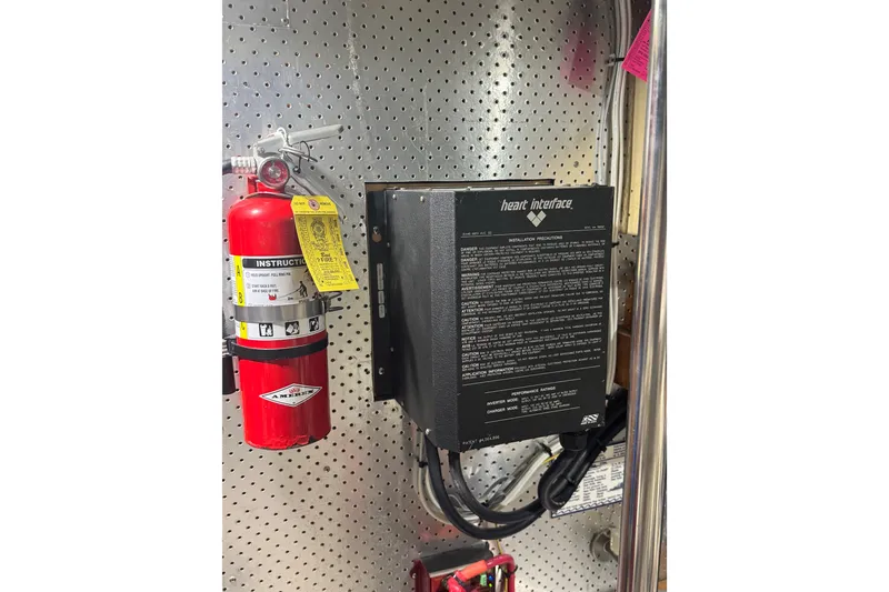 Slide: The Image of Fire extinguisher and electrical panel on 1989 DeFever 54 yacht. - 55