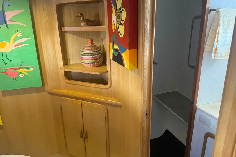 Slide: The Image of Interior of 1989 DeFever 54 yacht with colorful art and wooden cabinetry. - 28
