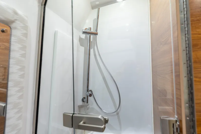 Slide: The Image of Shower area in 2026 Phenom 43 Center Console boat, featuring sleek design and modern fixtures. - 9