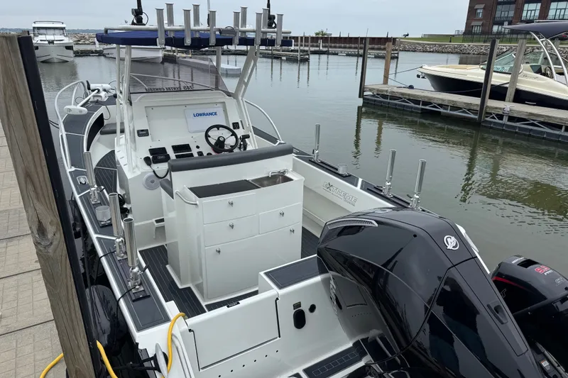 Slide: The Image of 2021 Extreme Boats 745 Center Console 24' docked, featuring modern design and equipment. - 7
