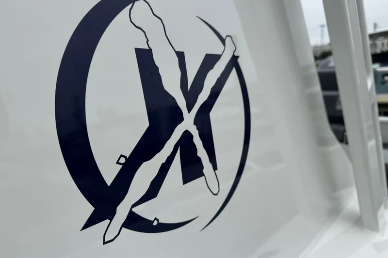 Slide: The Image of Logo on 2021 Extreme Boats 745 Center Console, featuring stylized "X" design. - 17