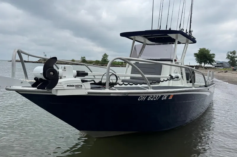 The Image of 2021 Extreme Boats 745 Center Console 24' on water, featuring Minn Kota Terrova motor. - 1