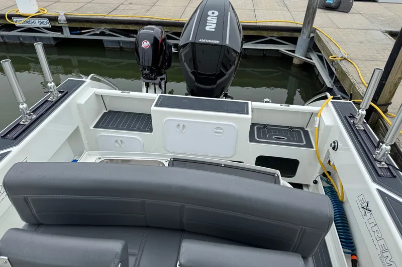 Slide: The Image of 2021 Extreme Boats 745 Center Console 24' with Mercury outboard at dock. - 15