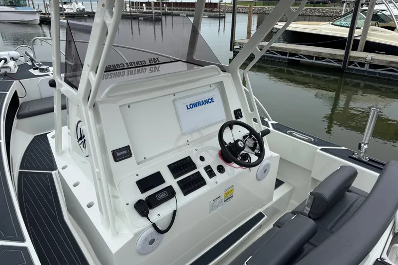 Slide: The Image of 2021 Extreme Boats 745 Center Console 24' with advanced navigation system at marina. - 16