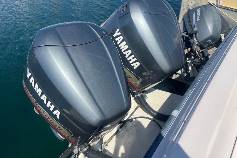 Slide: The Image of Twin Yamaha outboard motors on a 1996 Grady-White Gulfstream 232 boat. - 25