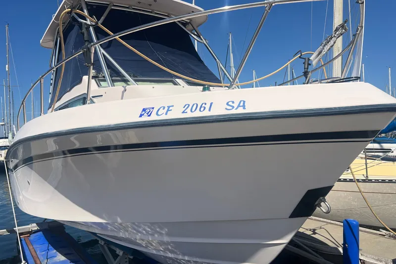 Slide: The Image of 1996 Grady-White Gulfstream 232 boat docked at marina, sunny day. - 15