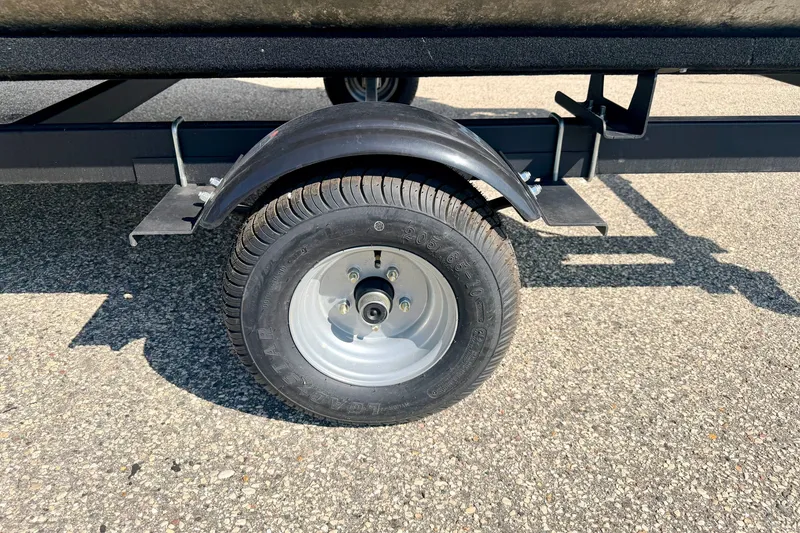Slide: The Image of Trailer wheel of a 2011 Palm Beach Sport Fish 1623 SE on asphalt. - 52