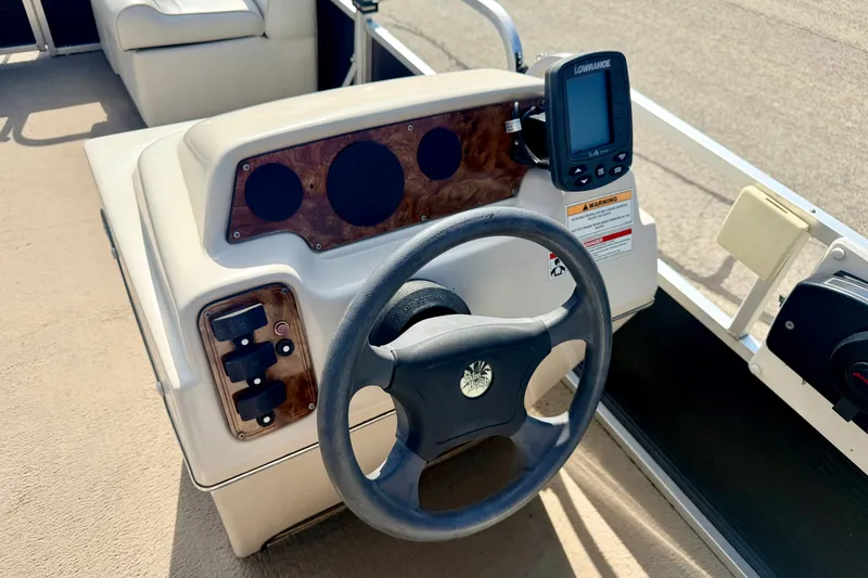 Slide: The Image of Steering console of 2011 Palm Beach Sport Fish 1623 SE with navigation display. - 33