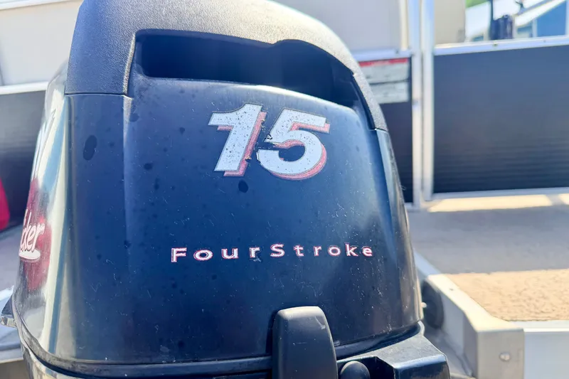 Slide: The Image of Outboard motor with "15 FourStroke" label on a 2011 Palm Beach Sport Fish 1623 SE boat. - 18
