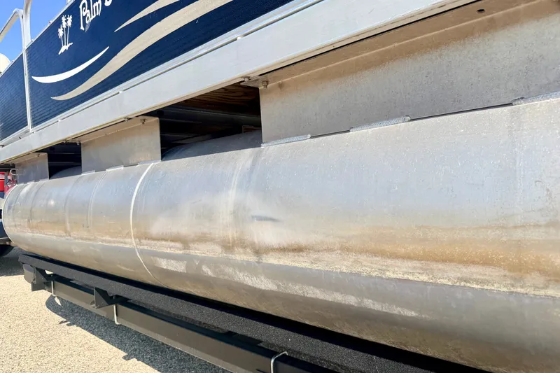 Slide: The Image of 2011 Palm Beach Sport Fish 1623 SE pontoon boat, side view, showcasing aluminum hull. - 15
