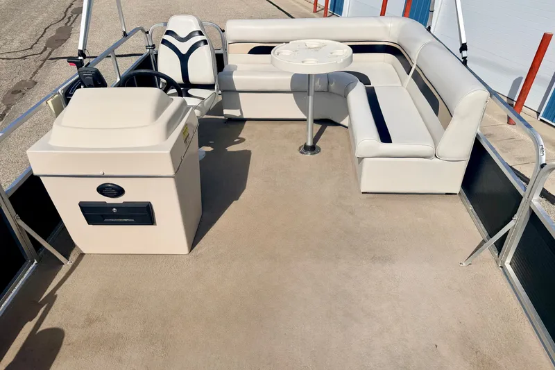 Slide: The Image of 2011 Palm Beach Sport Fish 1623 SE boat interior with seating and steering console. - 43
