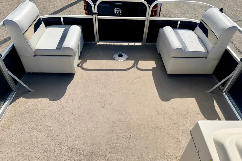 Slide: The Image of 2011 Palm Beach Sport Fish 1623 SE boat interior with cushioned seating and open deck space. - 44