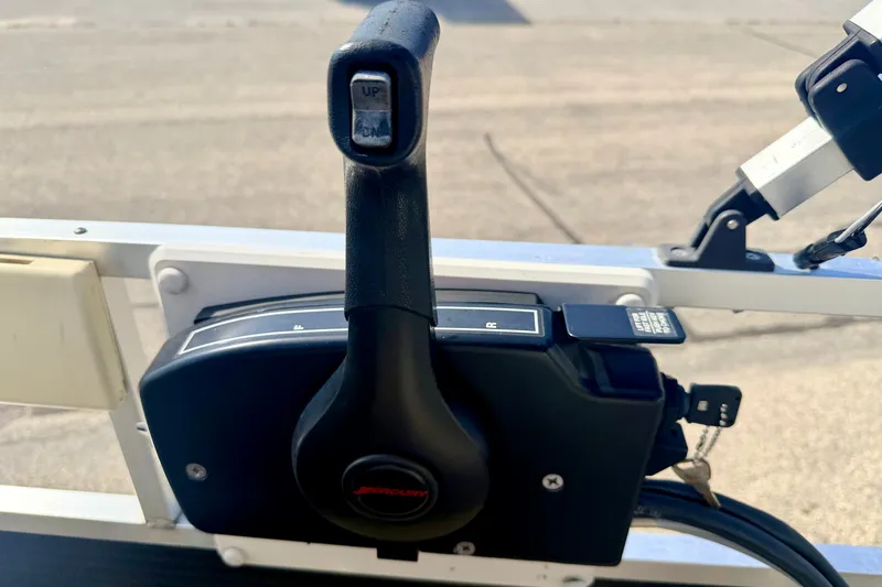Slide: The Image of Close-up of a 2011 Palm Beach Sport Fish 1623 SE boat throttle control. - 37