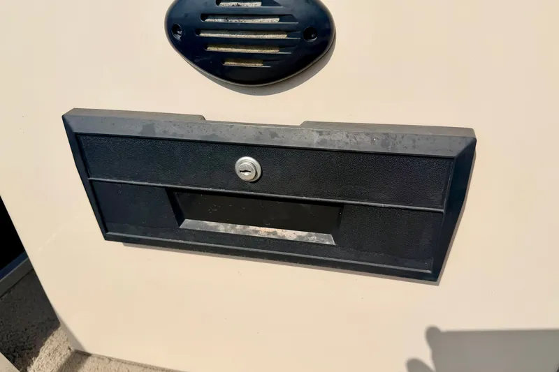 Slide: The Image of Black storage compartment on 2011 Palm Beach Sport Fish 1623 SE boat. - 47