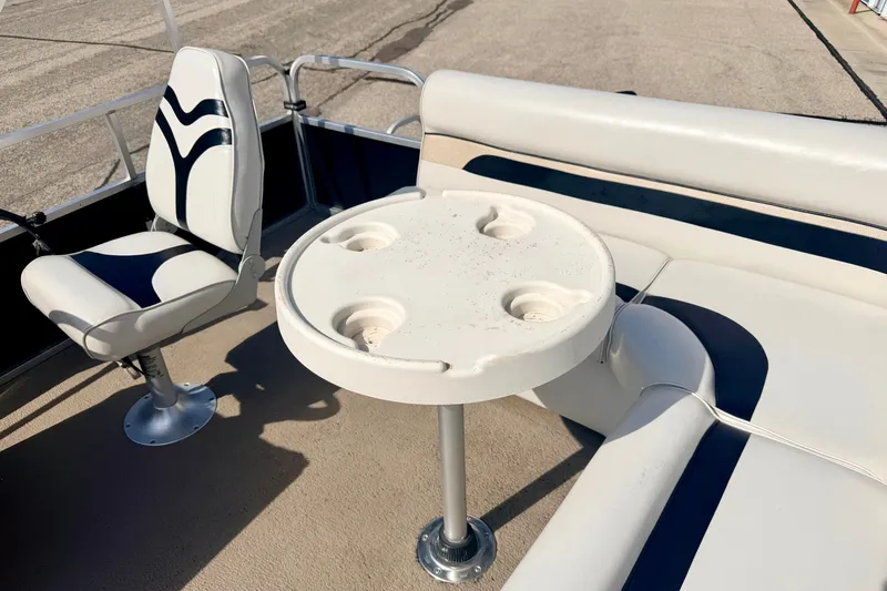 Slide: The Image of Interior of 2011 Palm Beach Sport Fish 1623 SE boat with seating and table. - 30