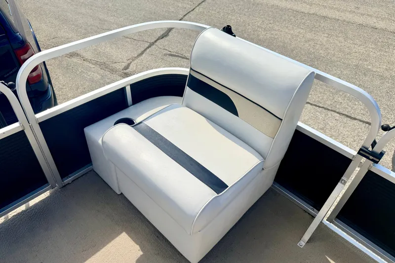 Slide: The Image of White seating on 2011 Palm Beach Sport Fish 1623 SE boat, featuring cup holder and railing. - 39