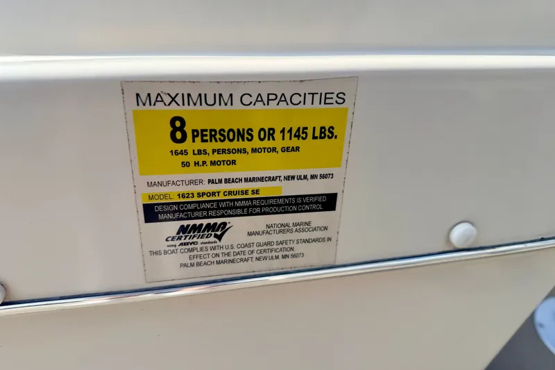 Slide: The Image of Capacity label on 2011 Palm Beach Sport Fish 1623 SE, max 8 persons or 1145 lbs. - 38