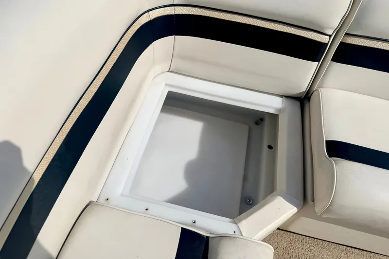 Slide: The Image of 2011 Palm Beach Sport Fish 1623 SE boat seat storage compartment, white with black accents. - 27
