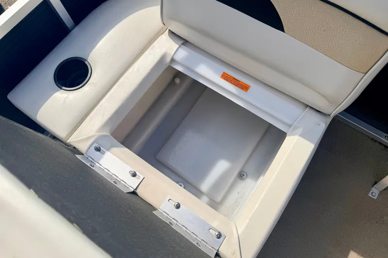 Slide: The Image of Open storage compartment on 2011 Palm Beach Sport Fish 1623 SE boat seat. - 40
