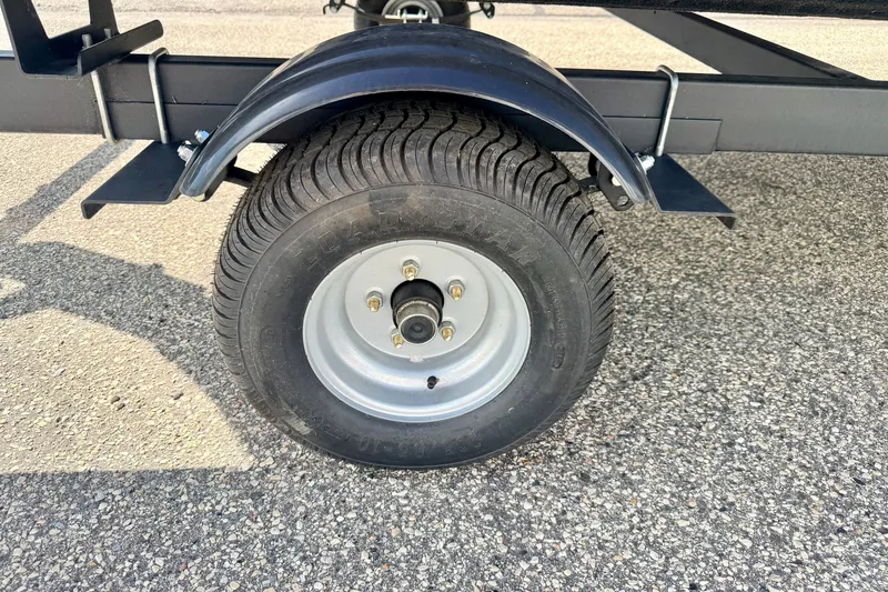 Slide: The Image of Trailer wheel of 2011 Palm Beach Sport Fish 1623 SE on asphalt surface. - 54
