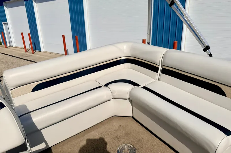 Slide: The Image of White and blue seating on 2011 Palm Beach Sport Fish 1623 SE boat, near blue storage units. - 23