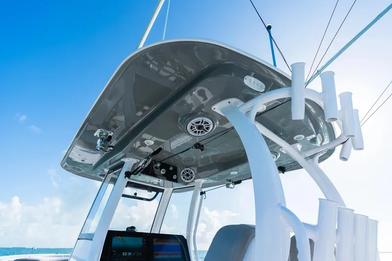 Slide: The Image of 2026 Sportsman Open 282 Center Console boat with advanced navigation system and rod holders. - 6