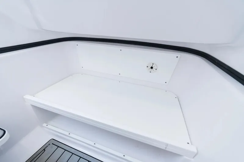 Slide: The Image of Interior view of 2026 Sportsman Open 282 Center Console boat, featuring sleek white seating. - 11