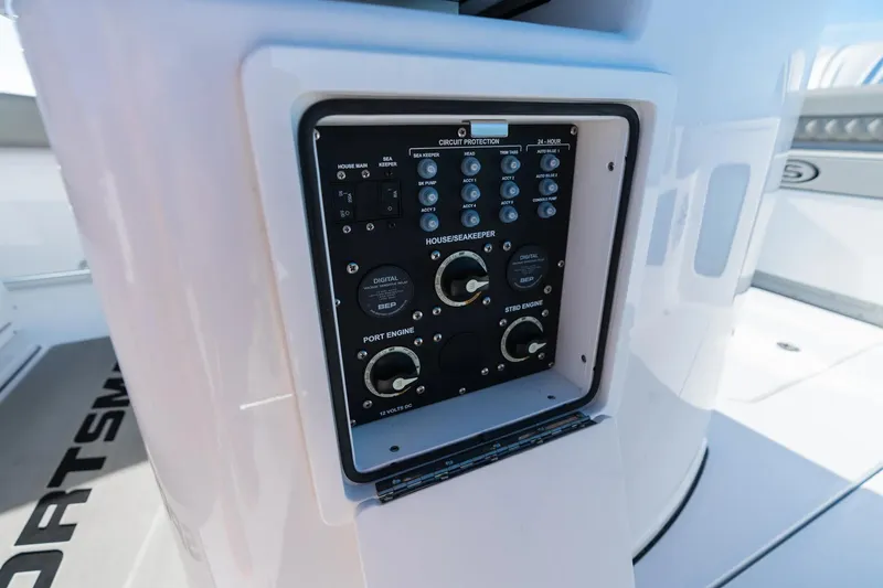 Slide: The Image of 2026 Sportsman Open 282 Center Console control panel with circuit protection and engine controls. - 15
