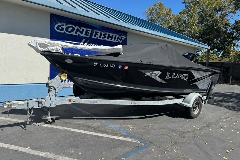 Slide: The Image of 2021 Lund 1775 Crossover XS boat on trailer, parked outside Gone Fishin' Marine. - 19
