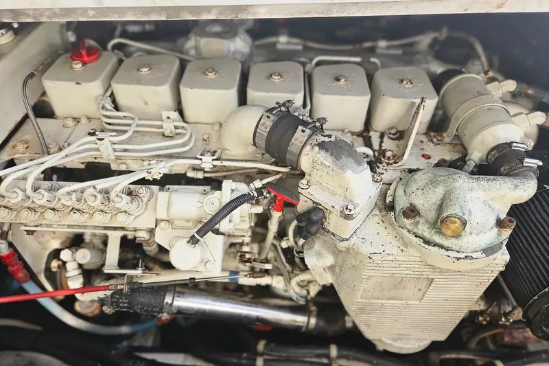 Slide: The Image of Engine of a 2000 Albin 31 Tournament Express boat, showcasing mechanical components. - 31