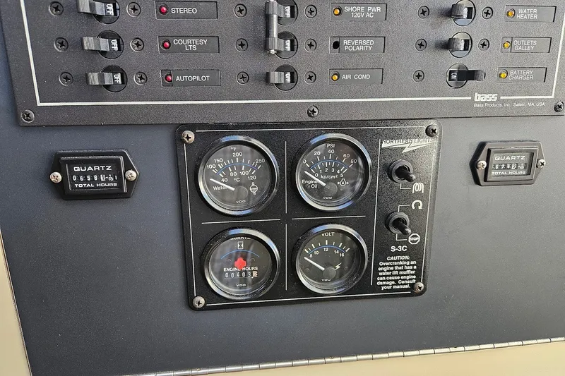 Slide: The Image of Control panel of a 2000 Albin 31 Tournament Express with gauges and switches. - 18