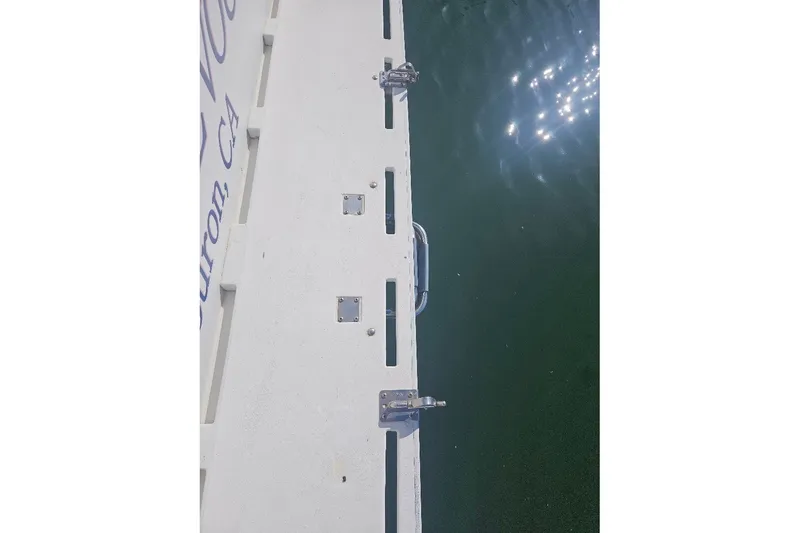 Slide: The Image of Rear deck of 2000 Albin 31 Tournament Express boat with water reflection. - 8