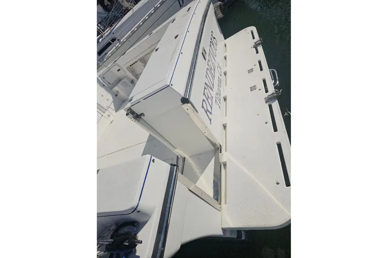 Slide: The Image of Rear view of a 2000 Albin 31 Tournament Express boat docked at a marina. - 7