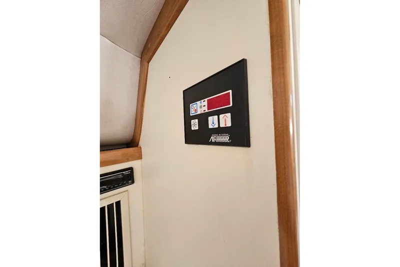 Slide: The Image of Control panel inside 2000 Albin 31 Tournament Express boat cabin. - 27