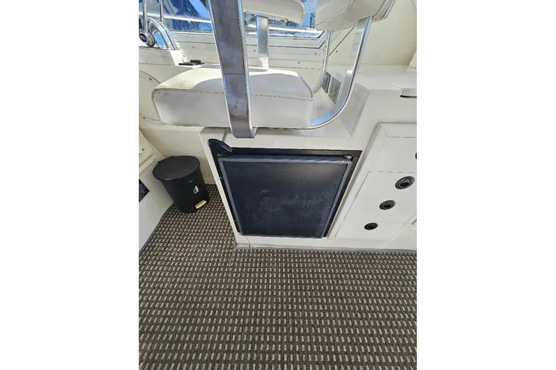 Slide: The Image of Interior of 2000 Albin 31 Tournament Express boat with seating and storage. - 13