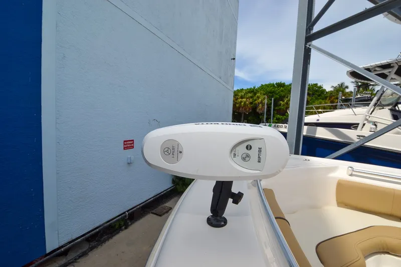 Slide: The Image of A 2018 Key West 219 FS with a white Minn Kota trolling motor at the front. - 8
