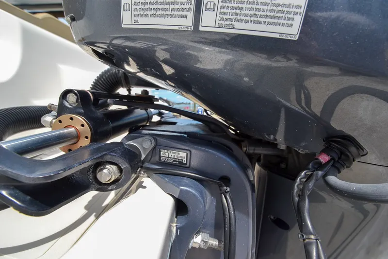 Slide: The Image of Close-up of a boat engine with visible cables and hoses. - 23