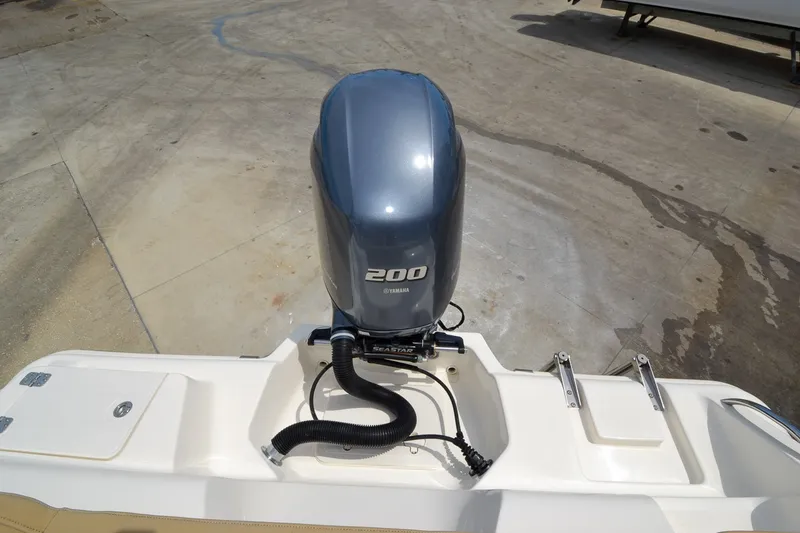 Slide: The Image of A 200 horsepower outboard motor is mounted on the stern of a Key West 219 FS boat. - 7