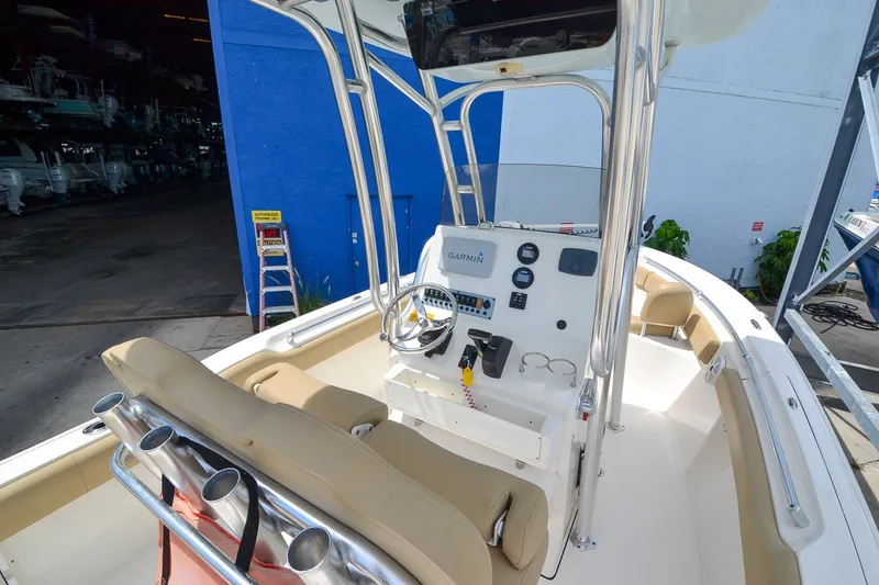 Slide: The Image of The image shows the cockpit of a 2018 Key West 219 FS boat with a modern helm station. - 22