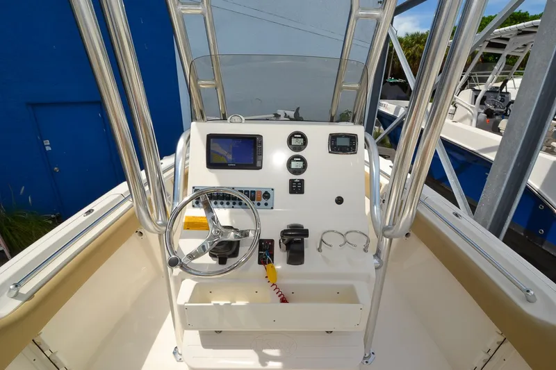Slide: The Image of The image shows the helm of a 2018 Key West 219 FS boat with navigation system. - 9