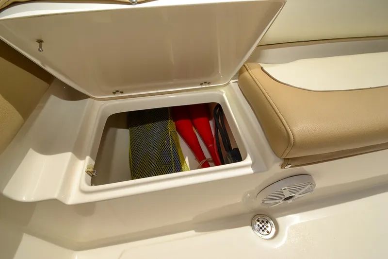 Slide: The Image of An open storage compartment on a boat with life jackets and a speaker nearby. - 31