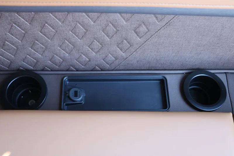 Slide: The Image of Close-up of cup holders and a compartment on a boat. - 32