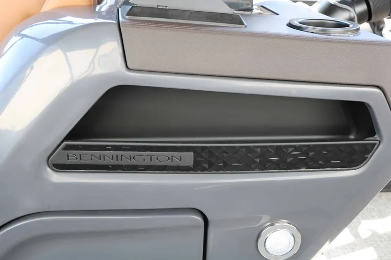 Slide: The Image of Close-up of a gray boat part with Bennington logo and modern design. - 37