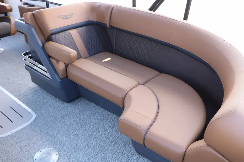 Slide: The Image of Luxurious curved seating with brown leather upholstery and quilted pattern on a boat. - 29