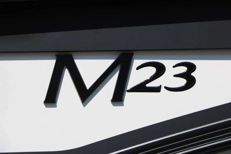 Slide: The Image of Close-up of the "M23" lettering on a boat. - 24