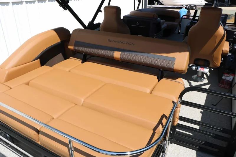 Slide: The Image of The image shows the luxurious brown upholstery of a 2027 Bennington 23 MSB. - 49